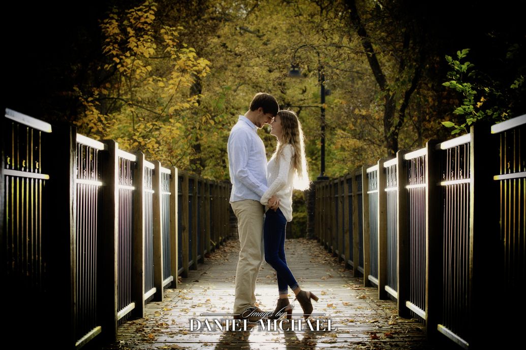 Couple hugging on bridge